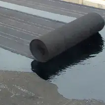 4 layers of asphalt and felt papers make up the roof system